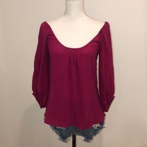 Long sleeved fuchsia blouse with shoulder cutouts